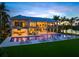 Elegant home with outdoor living and a pool with sun loungers offering a luxurious and relaxing setting at 612 Juan Anasco Dr, Longboat Key, FL 34228