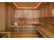 Beautiful sauna with wood benches, interior lighting, and a digital control panel at 612 Juan Anasco Dr, Longboat Key, FL 34228