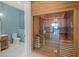 Luxurious bathroom with a sauna featuring wood paneling, glass door, and accent lighting at 612 Juan Anasco Dr, Longboat Key, FL 34228