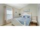 Bedroom featuring a large window and white furniture at 6226 Blueflower Ct, Lakewood Ranch, FL 34202