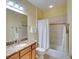 Bright bathroom with a granite countertop vanity, tiled shower and tub combination, and modern fixtures at 6512 Moorings Point Cir # 201, Lakewood Ranch, FL 34202