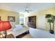 Inviting primary bedroom featuring plush carpet, a ceiling fan, and ample natural light streaming through the windows at 6512 Moorings Point Cir # 201, Lakewood Ranch, FL 34202