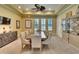 Elegant dining room with a large table, perfect for hosting gatherings and creating memorable meals at 6512 Moorings Point Cir # 201, Lakewood Ranch, FL 34202