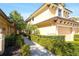 Charming property with lush landscaping and a brick walkway to the entrance at 6512 Moorings Point Cir # 201, Lakewood Ranch, FL 34202