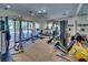 Bright fitness center with modern equipment and floor-to-ceiling windows overlooking the outdoors at 6512 Moorings Point Cir # 201, Lakewood Ranch, FL 34202