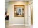 Hallway leading to bedroom with mirror at 6512 Moorings Point Cir # 201, Lakewood Ranch, FL 34202
