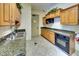 Community kitchen with stainless steel appliances, granite counters, and ample cabinet space for easy meal preparation at 6512 Moorings Point Cir # 201, Lakewood Ranch, FL 34202