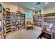 Quiet library featuring extensive bookshelves, comfortable seating, and natural light at 6512 Moorings Point Cir # 201, Lakewood Ranch, FL 34202