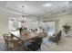 Spacious living and dining area with tile flooring, large windows, and an open floor plan that's great for entertaining at 6512 Moorings Point Cir # 201, Lakewood Ranch, FL 34202