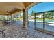 Screened patio featuring comfortable seating and views of the pool, great for relaxation and socializing at 6512 Moorings Point Cir # 201, Lakewood Ranch, FL 34202