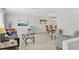 Open-concept living room with neutral tile floors, fresh paint, comfortable seating, and lots of natural light at 6732 Keystone Dr, Sarasota, FL 34231