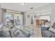 Open-concept living room with a seamless transition to the dining area and access to the patio at 6732 Keystone Dr, Sarasota, FL 34231
