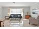 Bright living room featuring tile floors, neutral tones, large windows with lots of natural light at 6732 Keystone Dr, Sarasota, FL 34231