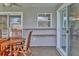 Covered patio featuring wooden table and chairs with built in shelving at 6732 Keystone Dr, Sarasota, FL 34231