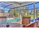 Screened-in pool area with table and chairs and clear views of the yard at 6732 Keystone Dr, Sarasota, FL 34231