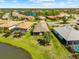 Enjoy picturesque water views from this lovely home with lush landscaping and mature palms at 6912 Gosport Cv, Bradenton, FL 34202
