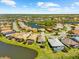 Enjoy stunning aerial views of this lakeside home and lush landscaping in a desirable golf course community at 6912 Gosport Cv, Bradenton, FL 34202