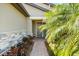 Inviting front entrance featuring a brick walkway, lush landscaping, and a modern front door at 6912 Gosport Cv, Bradenton, FL 34202