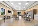 Large multipurpose room featuring tables, a sink and prep area, and a TV at 6912 Gosport Cv, Bradenton, FL 34202