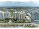 Beautiful aerial view of the condo buildings surrounded by cityscape and lush landscaping at 750 N Tamiami Trl # 814, Sarasota, FL 34236