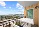 A charming balcony offers seating and panoramic views of the city skyline and sunny skies at 750 N Tamiami Trl # 814, Sarasota, FL 34236