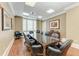 Boardroom with large table, leather chairs, and ample natural light at 750 N Tamiami Trl # 814, Sarasota, FL 34236