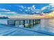 Picturesque view of pier at sunset with tranquil waters at 750 N Tamiami Trl # 814, Sarasota, FL 34236