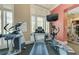 Well-equipped gym with modern cardio machines including a treadmill and elliptical for a full body workout at 750 N Tamiami Trl # 814, Sarasota, FL 34236