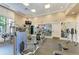 Bright fitness center with high-end exercise equipment, mirrored walls, and a wall mounted TV at 750 N Tamiami Trl # 814, Sarasota, FL 34236