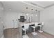 Charming kitchen area with bar stool seating, stainless steel appliances, and lots of bright light at 750 N Tamiami Trl # 814, Sarasota, FL 34236