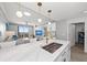 Bright, modern kitchen with marble counters and stainless steel appliances open to the beautifully decorated living space at 750 N Tamiami Trl # 814, Sarasota, FL 34236