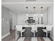 Bright kitchen featuring a breakfast bar with pendant lighting and modern bar stools at 750 N Tamiami Trl # 814, Sarasota, FL 34236