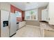 Well-equipped kitchen area with stainless steel fridge and granite countertops at 750 N Tamiami Trl # 814, Sarasota, FL 34236