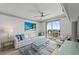 Comfortable living room with a balcony, stylish decor, and comfortable seating arrangements at 750 N Tamiami Trl # 814, Sarasota, FL 34236