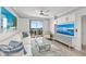 Bright living room with a balcony view, modern furnishings, and stylish decor at 750 N Tamiami Trl # 814, Sarasota, FL 34236