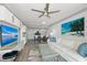 Open living space featuring a comfortable couch, a modern kitchen, and stylish decor at 750 N Tamiami Trl # 814, Sarasota, FL 34236