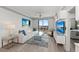 Cozy living room with a balcony view, comfortable seating, and stylish decor at 750 N Tamiami Trl # 814, Sarasota, FL 34236