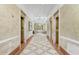 Elegant lobby featuring marble floors, detailed trim, and elevator access at 750 N Tamiami Trl # 814, Sarasota, FL 34236