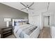 Comfortable main bedroom with a modern style, a nightstand, and a large closet at 750 N Tamiami Trl # 814, Sarasota, FL 34236