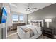 Comfortable main bedroom with a large window, stylish decor, and modern furnishings at 750 N Tamiami Trl # 814, Sarasota, FL 34236