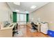 Well-lit shared office space with desks, chairs, and modern equipment at 750 N Tamiami Trl # 814, Sarasota, FL 34236