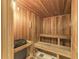 Beautiful sauna room features wood paneling, wood benches and flooring and an electric heater at 750 N Tamiami Trl # 814, Sarasota, FL 34236