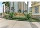 Community entrance sign amidst lush landscaping at Renaissance at Rosemary Place at 750 N Tamiami Trl # 814, Sarasota, FL 34236