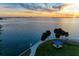 Scenic waterfront view, palm trees, and gathering area at 750 N Tamiami Trl # 814, Sarasota, FL 34236