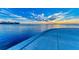 Panoramic waterfront view showcasing the city skyline and vibrant sunset reflecting on the calm waters at 750 N Tamiami Trl # 814, Sarasota, FL 34236