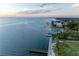 Scenic waterfront view featuring green space, docks, and blue waters at 750 N Tamiami Trl # 814, Sarasota, FL 34236