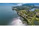Waterfront community features private docks along a winding canal surrounded by lush vegetation and stunning ocean views at 766 Bayshore Dr, Terra Ceia, FL 34250