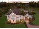 Expansive aerial view of a grand home with manicured lawns and mature trees at 766 Bayshore Dr, Terra Ceia, FL 34250