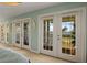 This room features multiple French doors that open to a large balcony with gorgeous waterfront views at 766 Bayshore Dr, Terra Ceia, FL 34250