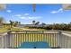Relaxing balcony with outdoor seating, offering picturesque views of the water and lush landscape at 766 Bayshore Dr, Terra Ceia, FL 34250